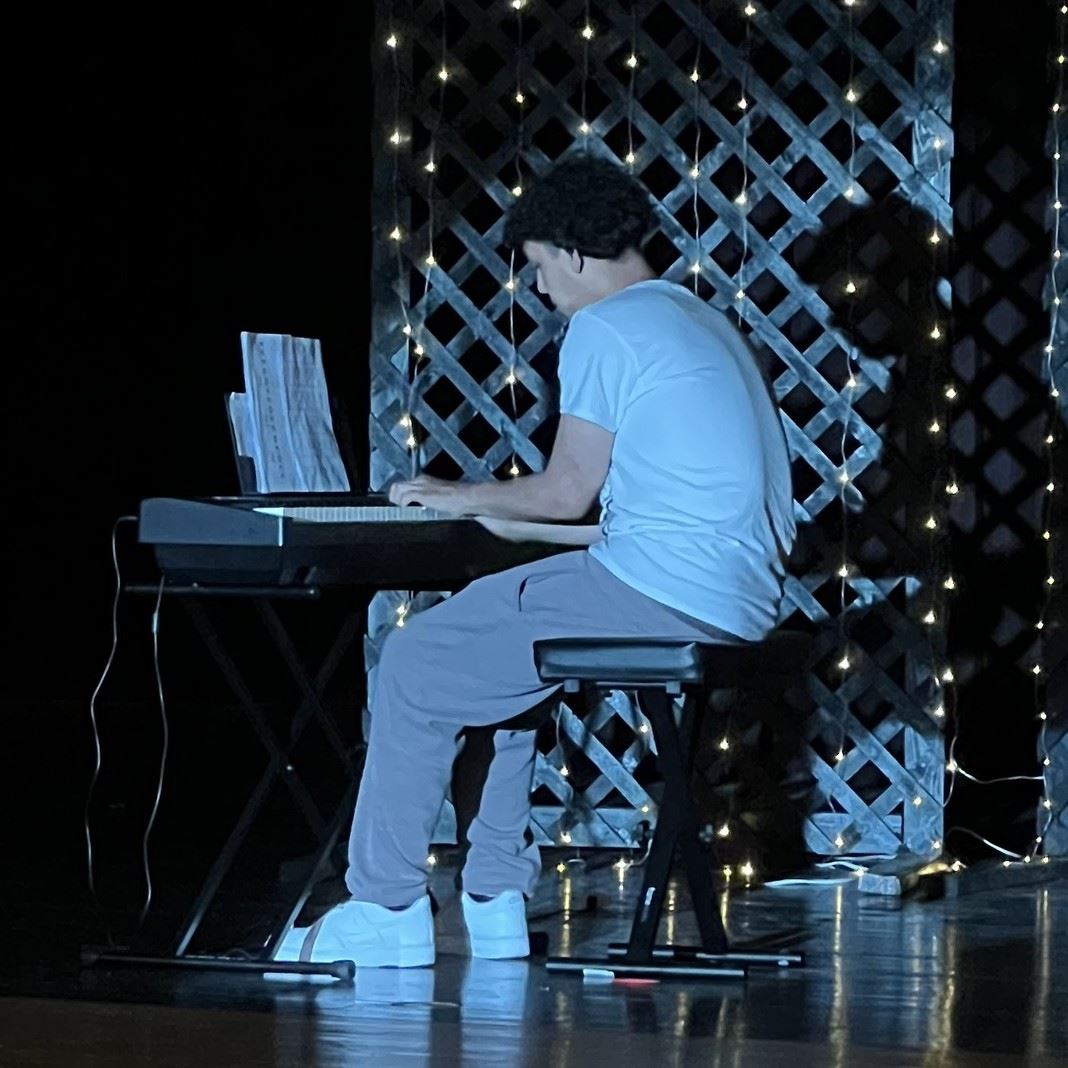  A student performs on a piano